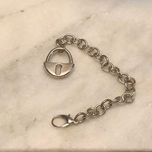 Silver bracelet with dangling lock